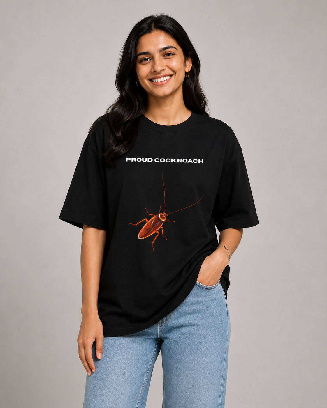 A Female Model wearing a black t-shirt with a graphic of a cockroach and text, on a plain background