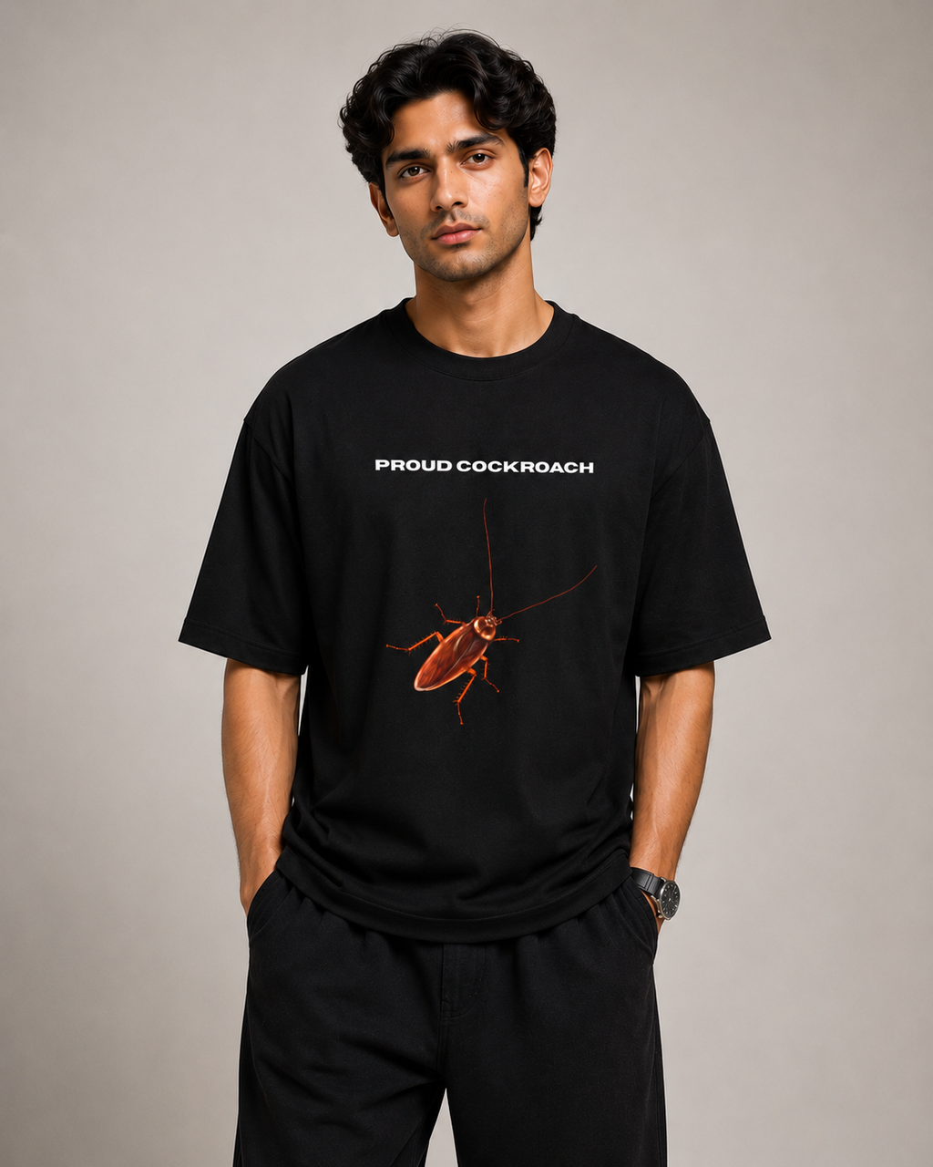 Male Model wearing a black t-shirt with a graphic of a cockroach and text on a plain background