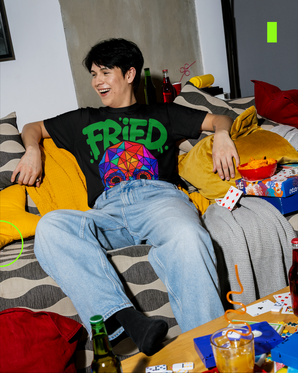 Model wearing psychedelic neon skull oversized black t-shirt by LMNO streetwear at a house party